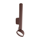 Berry W Aluminium LED Wall Light in bronze, featuring a slim upright stem on a rectangular wall plate with a round swivel head casting light downward, shown on a plain white background.