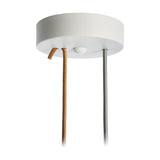 Close-up of the white round ceiling canopy for the Paros Alabaster Pendant Light, showing the fabric cable exits against a plain white background.