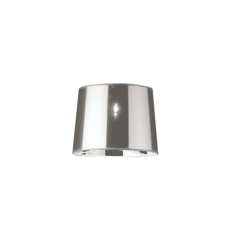 The Lucidia Lampshade - Chrome, with its smooth and reflective metallic finish, stands elegantly against a plain white background, showcasing its modern lighting appeal.
