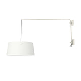 Raisa Fabric Drum Adjustable Swing Arm Wall Light in matt white, with a long angled iron arm and white fabric drum shade suspended on a cable, shown against a plain white background.