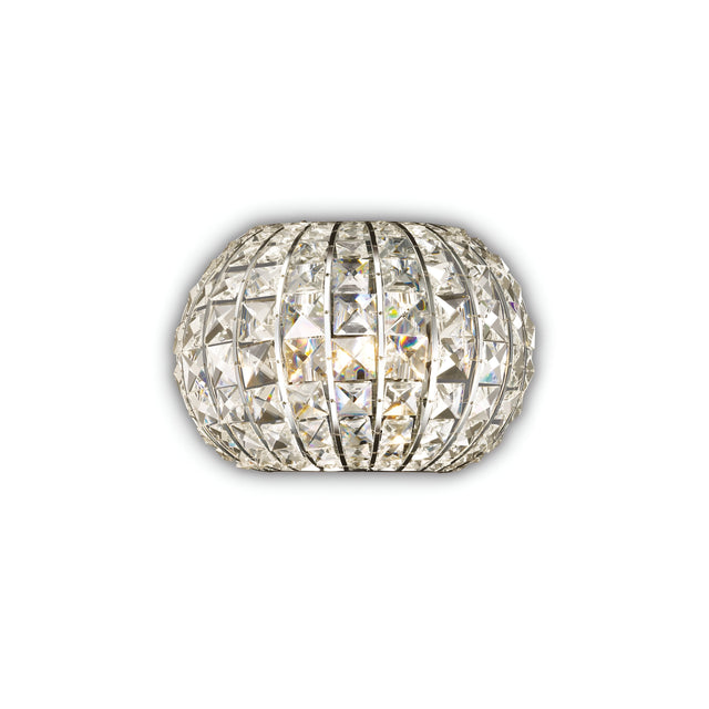The Auroral Wall Light - Chrome, featuring a spherical design with intricately arranged reflective square facets, produces a dazzling and luminous effect. Enhanced with a dimmable feature, its metallic frame sparkles brilliantly from various angles, offering customizable brilliance for any space.