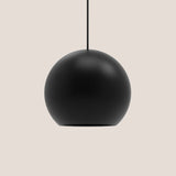 Nelly Globe Pendant Light in matt black aluminium, spherical shade with base opening, black textile cable, on a plain light background.