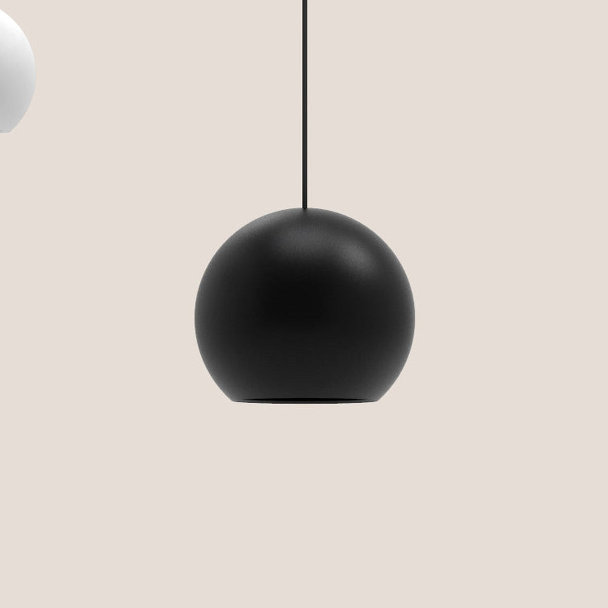 Nelly Globe Pendant Light in matt black aluminium, spherical shade on a black textile cable, shown against a plain light background.