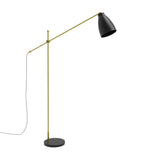 Nala adjustable floor lamp with matt black dome shade, gold pivoting arm, slim upright stem and round black marble base, shown on a plain white background.