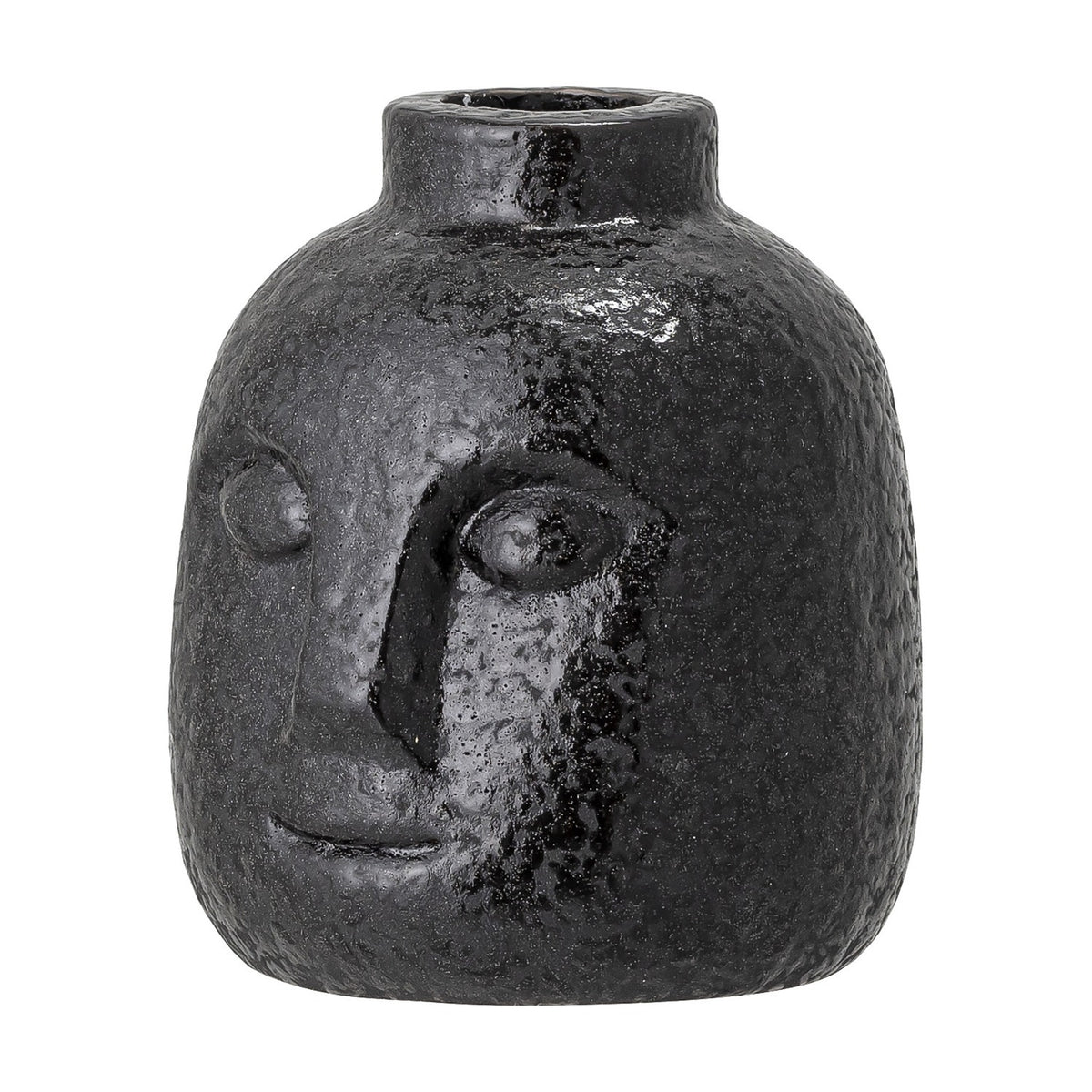 Eliot Stoneware Candle Holder in black, a face-shaped ceramic vase-style holder with raised eyes, nose and smile, textured glossy finish, on a plain white background.