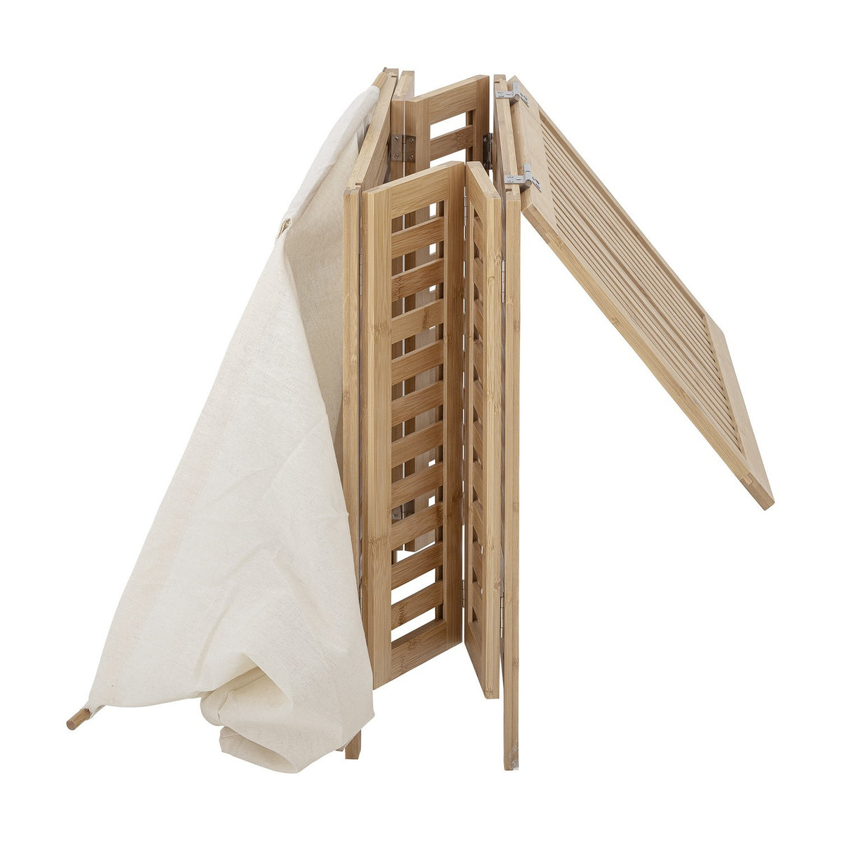 Aden Bamboo Laundry Basket partially folded, showing slatted natural bamboo panels, hinged frame with metal hinges, and a cream cotton liner draped alongside, on a plain white background.