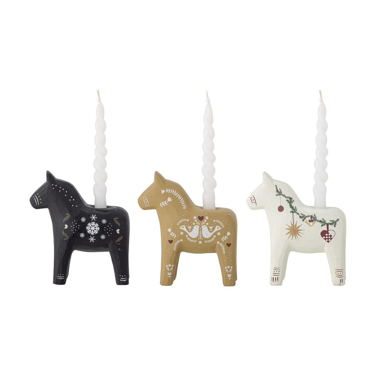 Set of three Siffer resin horse tealight candle holders in black, gold, and white with folk-art Christmas motifs, each holding a slim white candle, on a plain background.