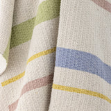 Pontino Striped Cotton Throw in cream, close-up of woven texture with green, blue, yellow, and pink horizontal stripes.
