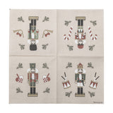 Beige paper Christmas napkin from the Jolly pack of 20, printed with four nutcracker designs per quarter including drums, candy canes, horns, and woven hearts.