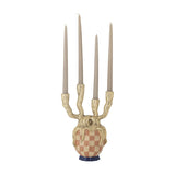 Medusa Resin Candle Holder in gold with four bark-textured branching arms holding taper candles, set on a checked patterned base with blue fluted foot, shown against a white background.