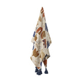 Anniversary Cotton Throw in multicoloured bird and wing print, shown hanging with navy tassel corners against a plain white background.