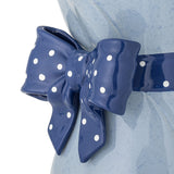 Close-up of the Belivia Bouquet Stoneware Vase in blue, showing its glossy polka-dot bow detail wrapped around the narrow waist against a mottled blue ceramic body.
