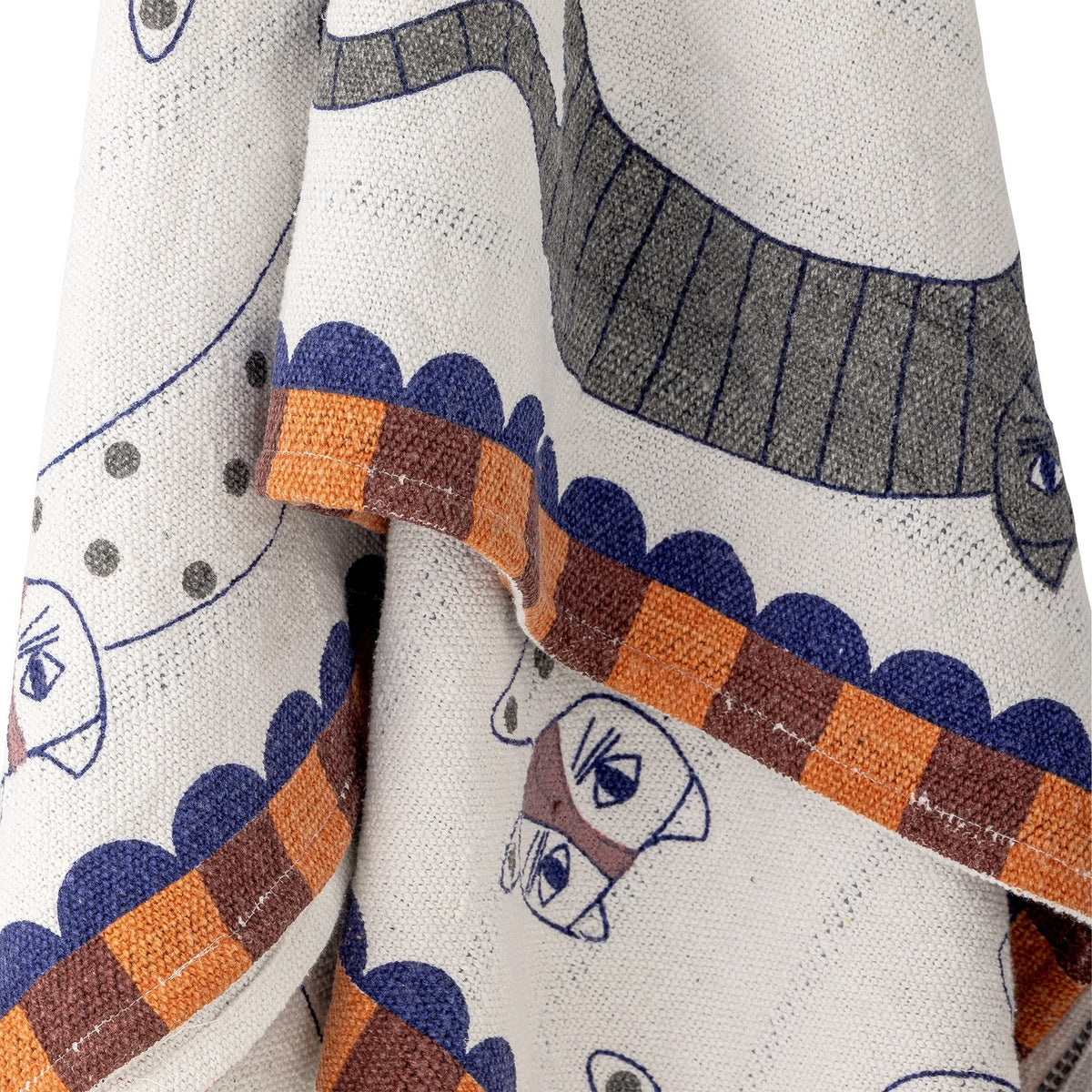 Missy Striped Throw in multicoloured cotton blend, close-up of striped cat motif with fine-line eyes, scalloped edge and checked block border in blue, orange and brown.