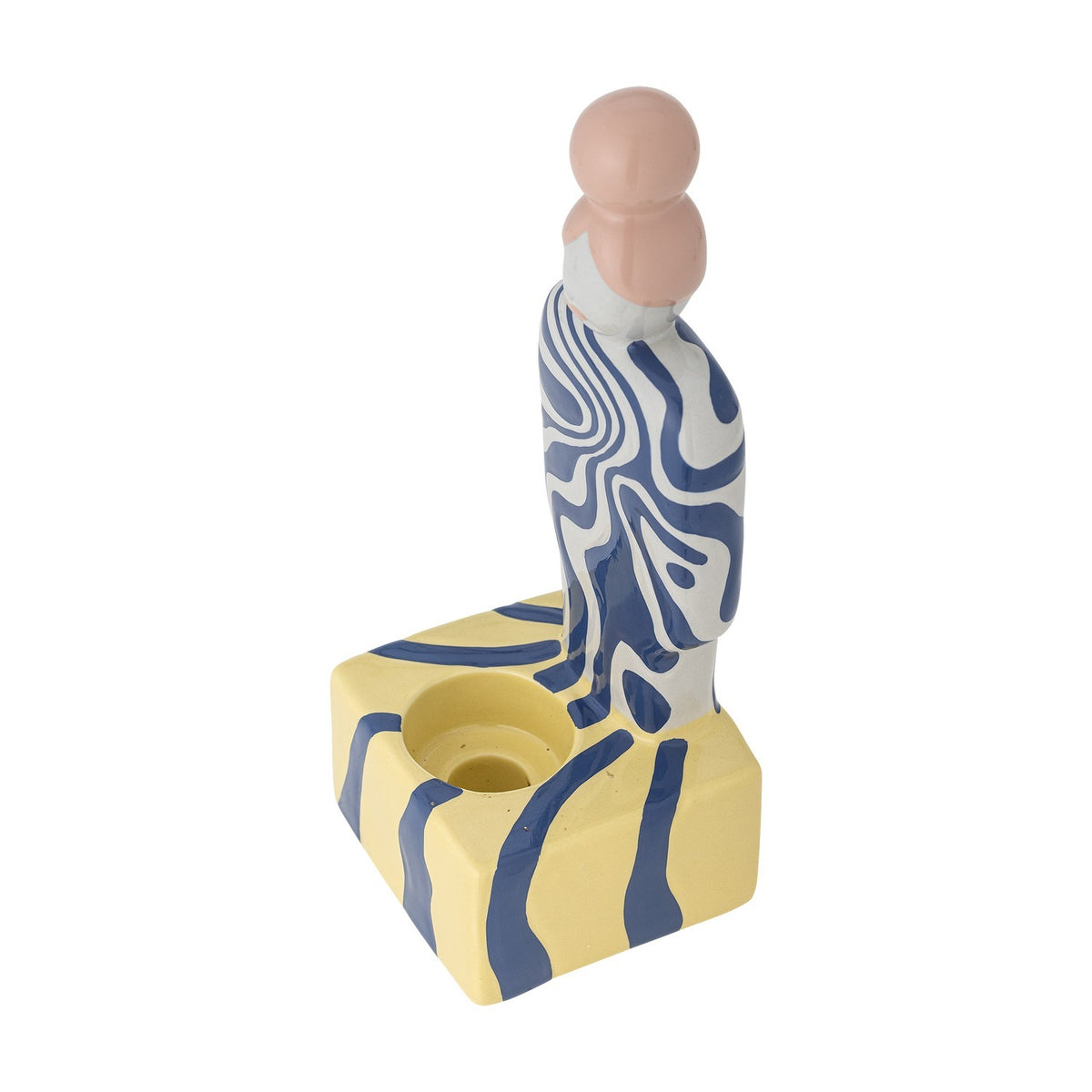 Priya Stoneware Tealight Holder in Multi, a figural holder shaped as a woman with a pink bun in blue and white swirls, standing on a yellow and navy striped base with a round tealight recess.