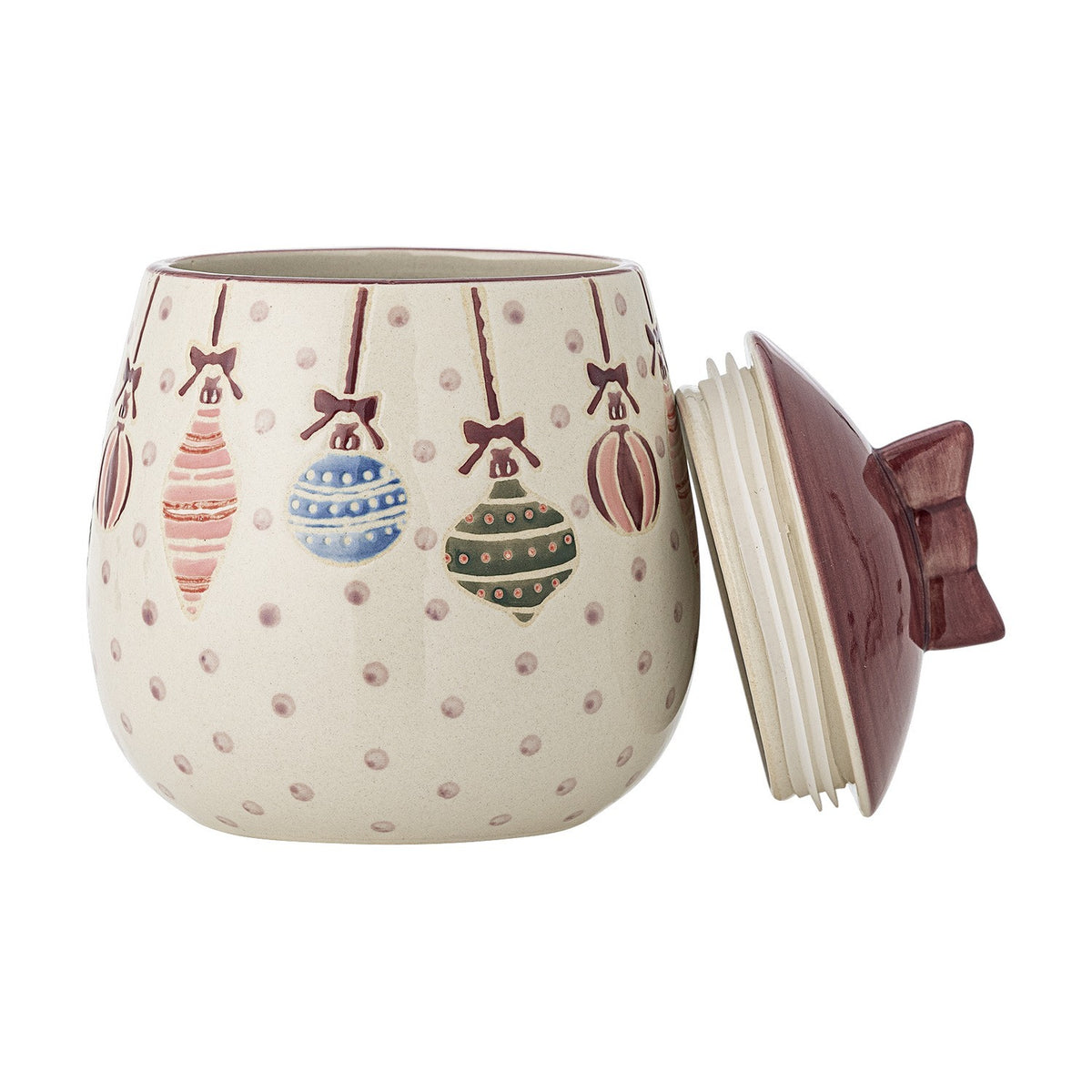 Ornamentia ceramic storage jar in cream with hand-painted hanging bauble pattern, shown with its removed burgundy lid featuring a bow-shaped knob, on a white background.