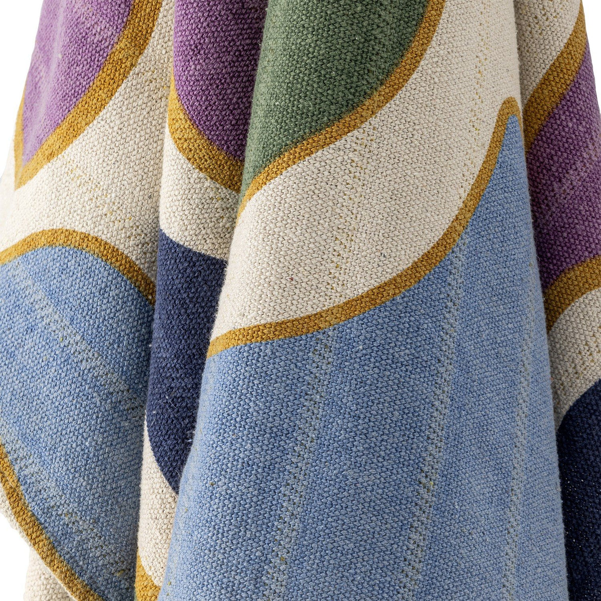 Salacia Throw in Multi, close-up of woven fabric with curved purple, green, blue, and navy bands edged in gold on a cream ground.