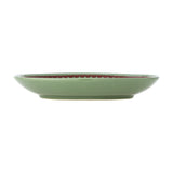 Side view of a Peo stoneware Christmas plate in green, showing its shallow round shape and footed base, set on a plain white background.