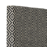 Rivalta Pin Board in black, showing a woven diamond-pattern surface with a solid 4cm-deep framed edge, photographed at an angle against a plain white background.