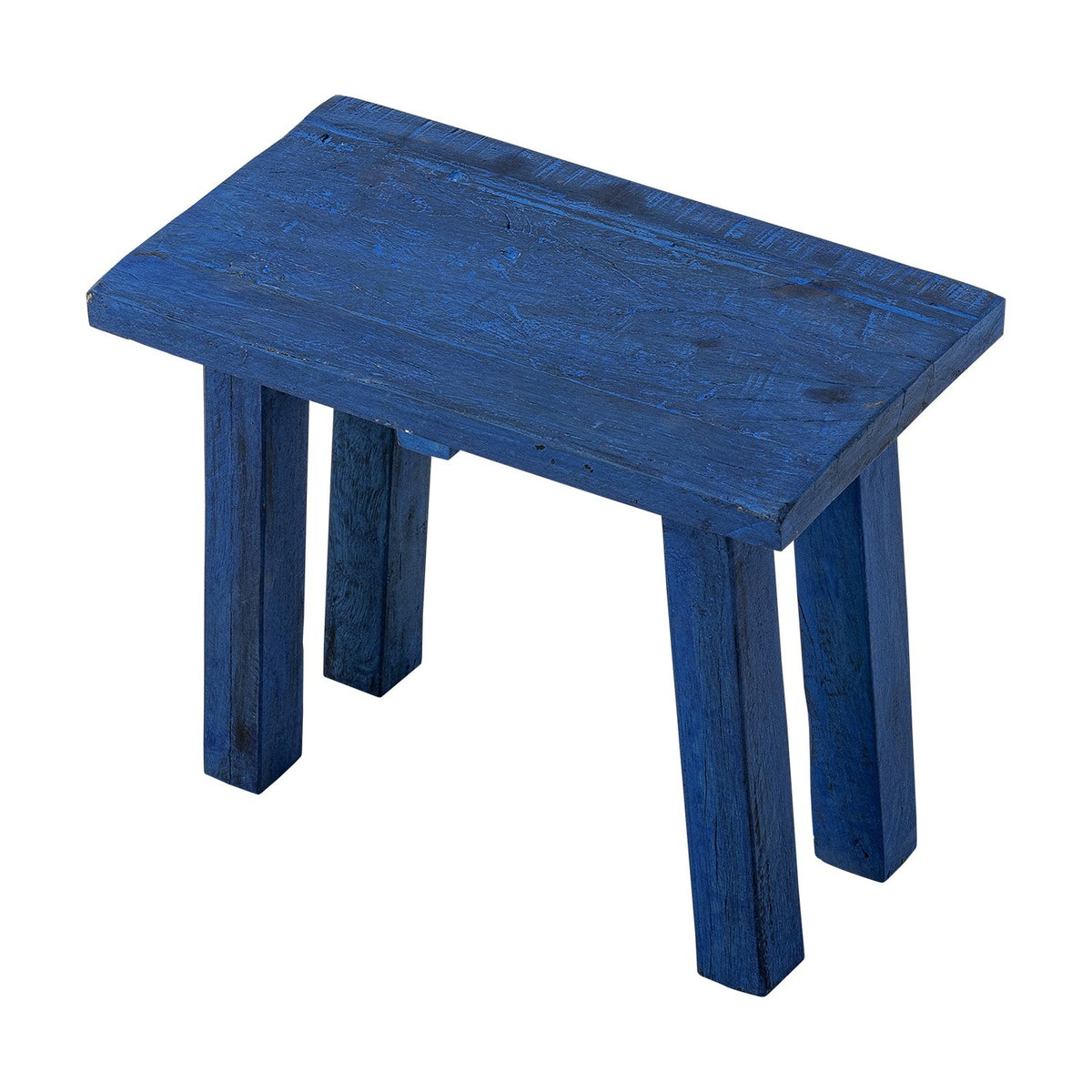 Porir Wooden Pedestal in blue, a rustic reclaimed wood stool-style stand with a rectangular top on four splayed legs, shown on a plain white background.