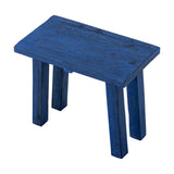 Porir Wooden Pedestal in blue, a rustic reclaimed wood stool-style stand with a rectangular top on four splayed legs, shown on a plain white background.