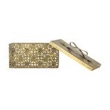 Gretl gold iron Christmas storage box with openwork floral and geometric panels, shown open with its lift-off lid featuring a bow detail, on a plain white background.