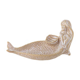 Abitha Shell Stoneware Bowl in beige, shaped as a reclining mermaid with a scaled tail forming the dish and a scallop shell held at her chest as a smaller hollow, shown on a plain white background.