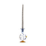 Phila Glass Candle Holder in Blue, a puffer fish-shaped glass holder with blue spine details, a small fin and flared blue cup, amber round base, tall candle inserted, on a plain white background.