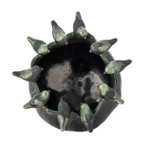 Charlize Stoneware Plant Pot in green, top-down view showing a dark glazed interior encircled by small modelled bird figures around the rim, set against a white background.