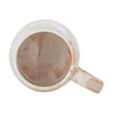 Top-down view of a Winnie marbled stoneware mug from the set of 4, showing the rounded rim, open loop handle, and reactive glaze in pink, brown, and cream tones on a white background.