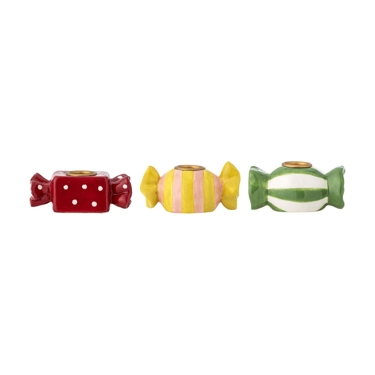 Set of three Leiano stoneware candle holders shaped like wrapped sweets with twisted ends, in red polka-dot, yellow-pink stripe, and green stripe designs with gold candle cups, on a white background.