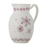 White stoneware Christmas jug with pouring lip and looped handle, featuring maroon snowflake motifs and patterned borders, shown on a plain white background.