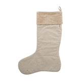 Ahsan beige fabric Christmas stocking with a folded velvet-textured cuff, woven slubbed body, and hanging loop, shown on a plain white background.