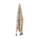 Yoti Floral Cotton Throw in multicoloured, hanging to show an all-over trailing floral print with grey tassels at each corner, against a plain white background.