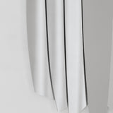 Close-up of the blade edges and the gaps between them, each blade taking the light on its own plane.