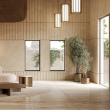Roma Glass LED Pendant Light in Brushed Bronze with slim vertical bars around glowing white panels, shown grouped in a warm-toned living room setting.