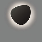 Tria 05 Wood LED Outdoor Wall Light in Graphite Brown Metal, a smooth pebble-shaped fixture casting a soft halo of warm light against a plain grey background.