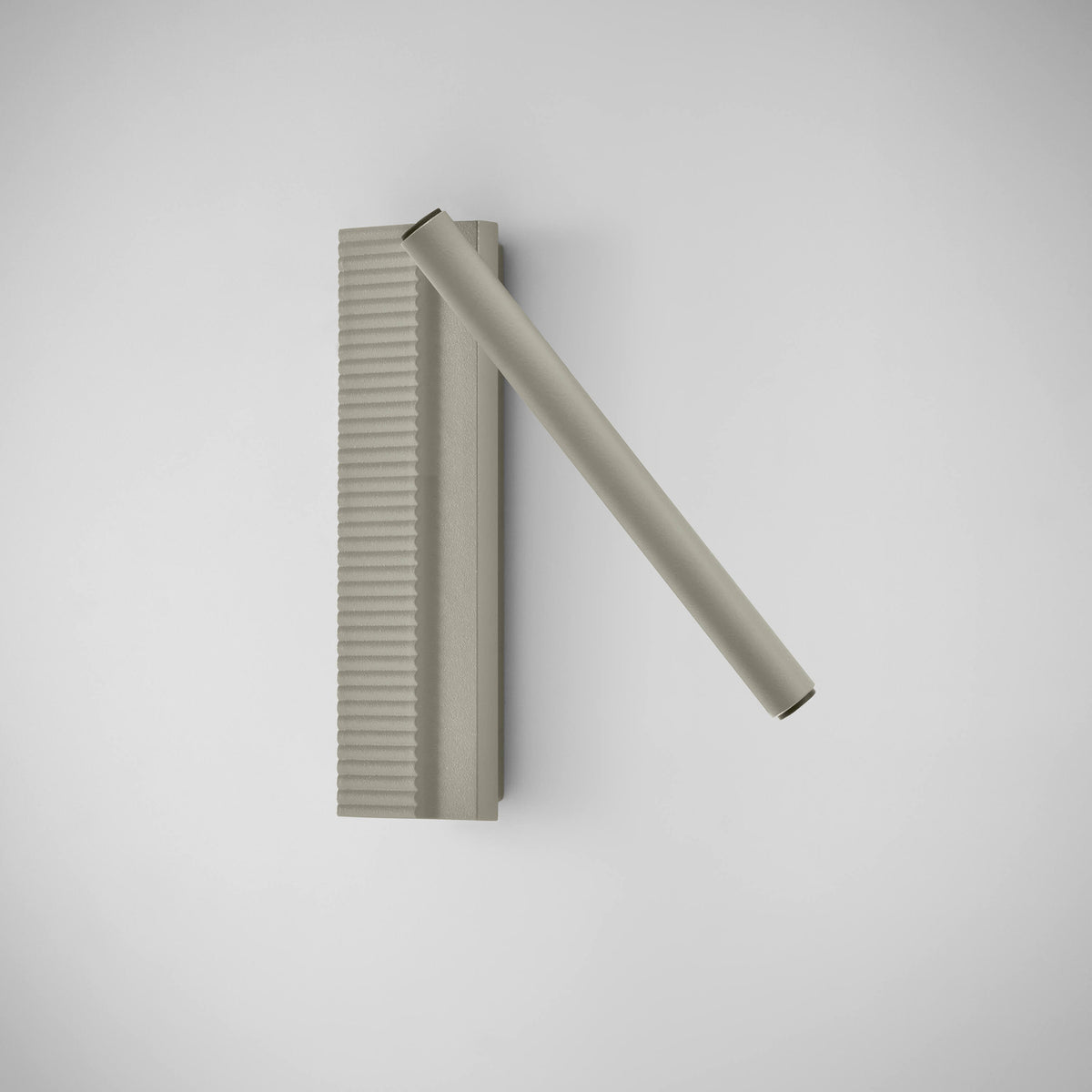 Arid A/03 LED wall light in Textured Pebble Grey, ribbed rectangular aluminium back plate with a slim diagonal tubular arm, shown on a plain light background.