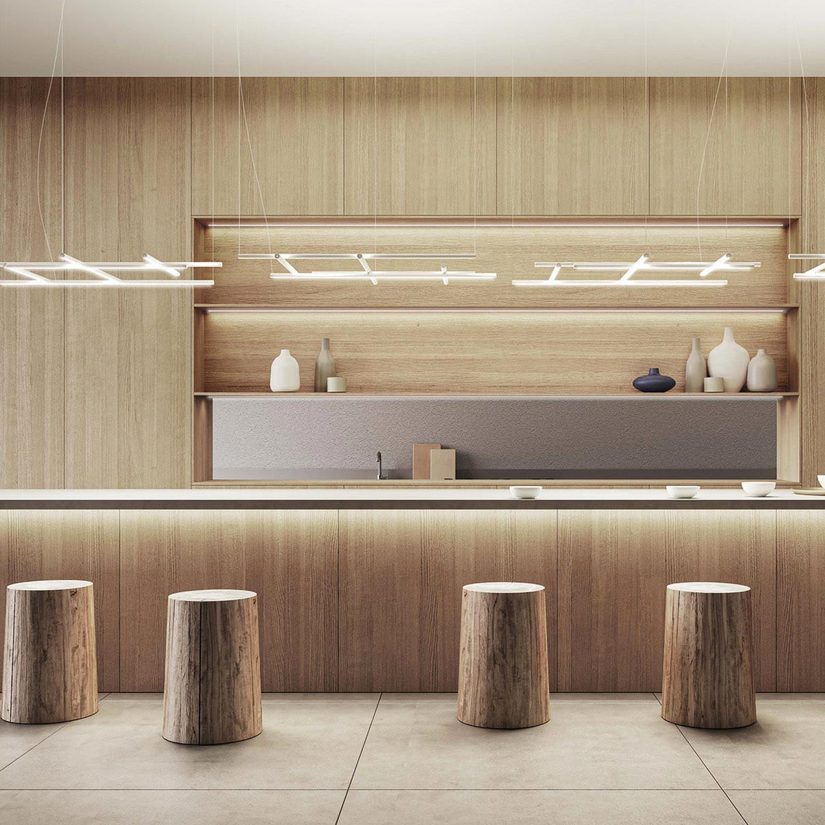 Hilow White Diffuser Frame LED pendant lights with crossed linear bars, shown in multiples above a wood-panelled bar counter with stump stools.