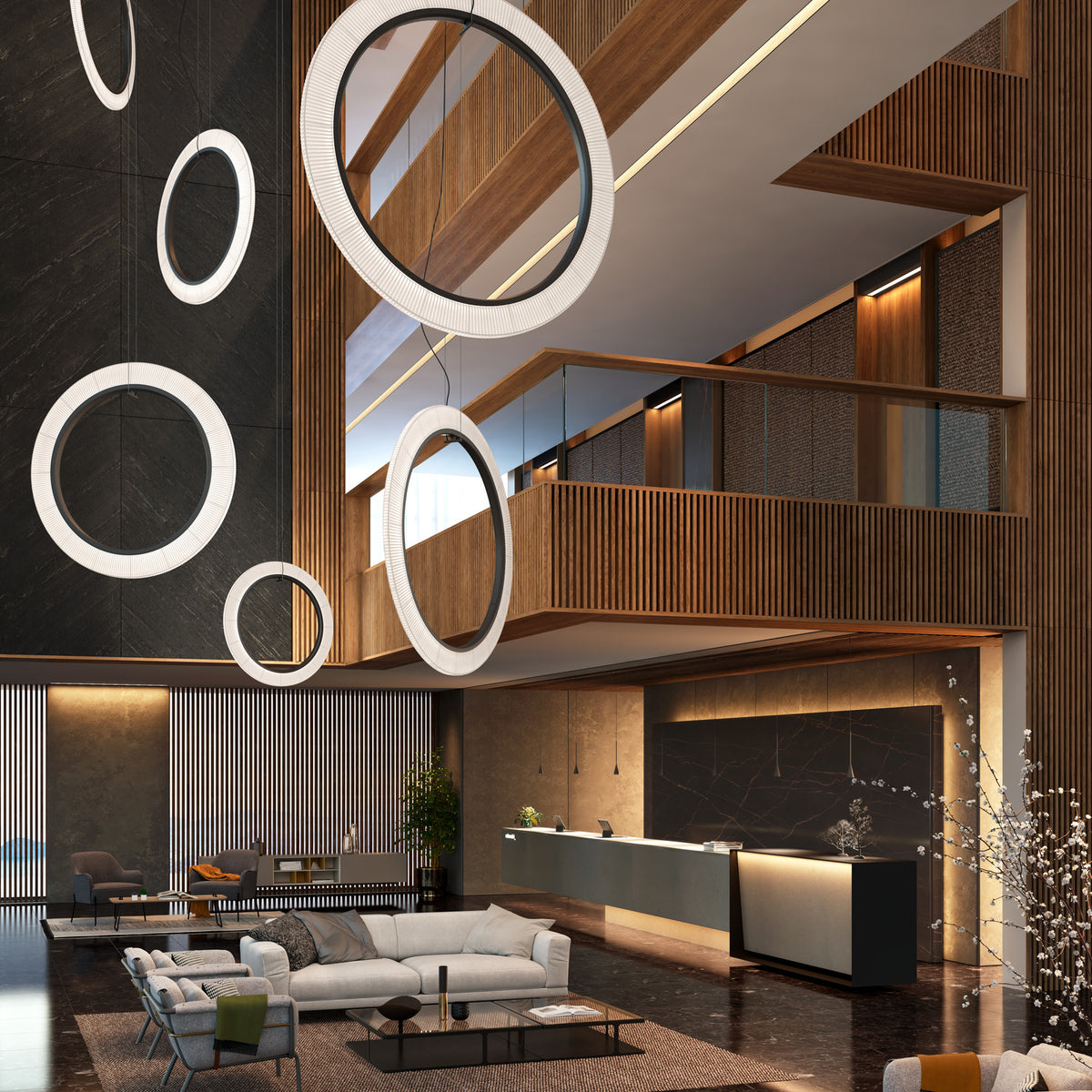 Roda S/200/V Ribbon Ring LED pendant lights in white, large circular pleated shades hanging at varying heights in a modern lobby with wood-slatted walls.