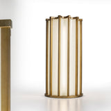 Roma Glass LED Table Lamp in Brushed Bronze, a tall cylindrical fixture with vertical bars framing white glass panels and a scalloped top, shown on a plain white background.