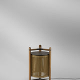 Kando M/40 Wood LED Table Lamp in Sand, a lantern-style design with sand-coloured cord shade inside a teak frame and dark brown top disc, shown on a plain light background.