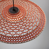 Close-up of the Nans S/55 woven LED outdoor pendant light with a wide shallow shade in red, orange, and beige fibre, graphite brown canopy, and warm white globe on a plain grey background.
