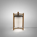 Kando M/40 Ribbon LED table lamp, lantern-style with pleated white translucent shade in an open wood frame with dark top disc, illuminated on a plain light grey background.