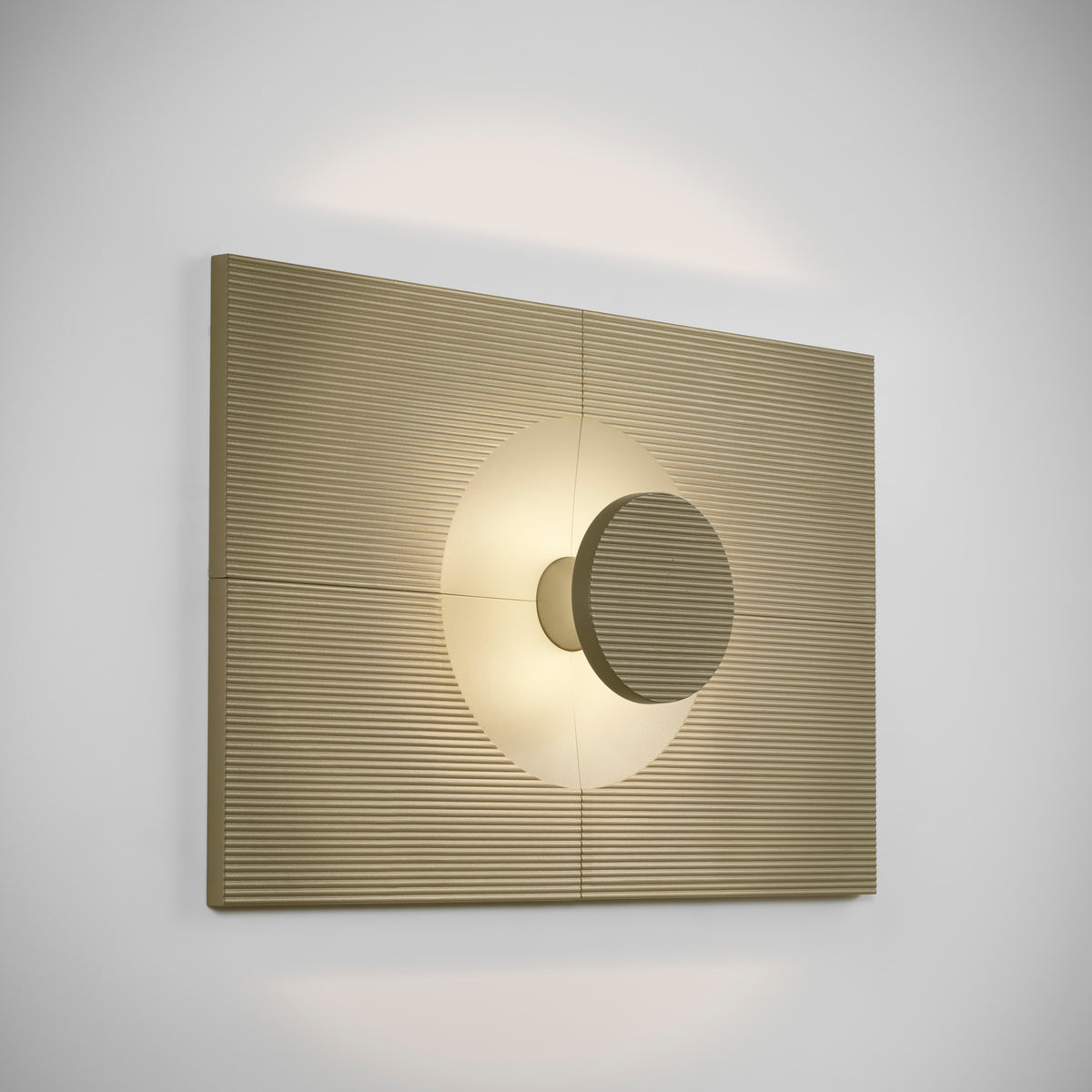 Arid Wall Light Tile in Textured Olive Grey, a fluted aluminium wall panel with a circular cut-out illuminated by a warm integrated light, shown on a plain light background.