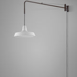 Marietta 32 A/98 outdoor wall light with long slim bronze arm and pleated white cone shade suspended on cable, shown against a plain grey background.