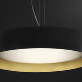 Close-up of the Ginevra 80cm LED pendant light, a wide matt black drum with a brass inner rim framing a white diffuser, shown against a dark background.
