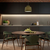 Soft S/30 Bell pendant light with olive grey textured aluminium shade and white diffuser, hung above a round wood dining table in a dark kitchen.