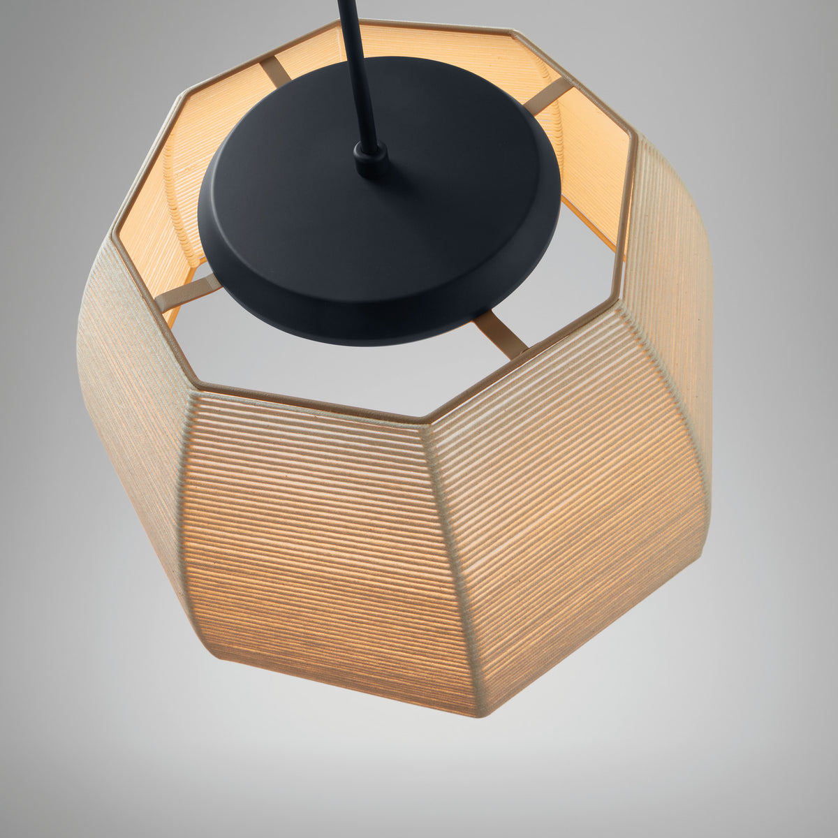 Tanit S/61 LED pendant light, octagonal faceted beige cotton thread shade with matt black canopy and stem, shown close-up from below on a plain grey background.