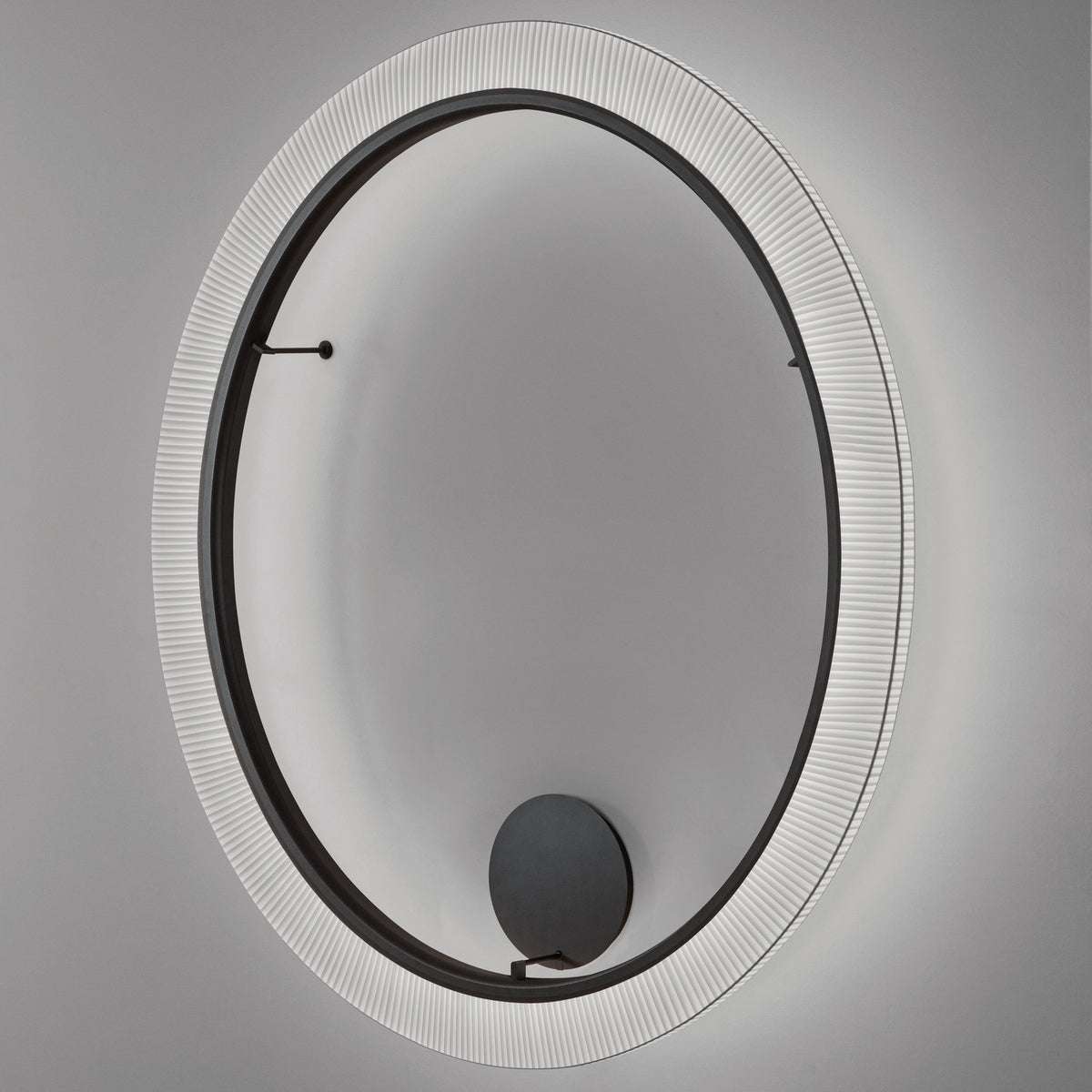 Roda PF/200 ribbon LED wall light, a large round fixture with pleated white translucent ribbon surrounding a dark inner ring, shown against a grey background.