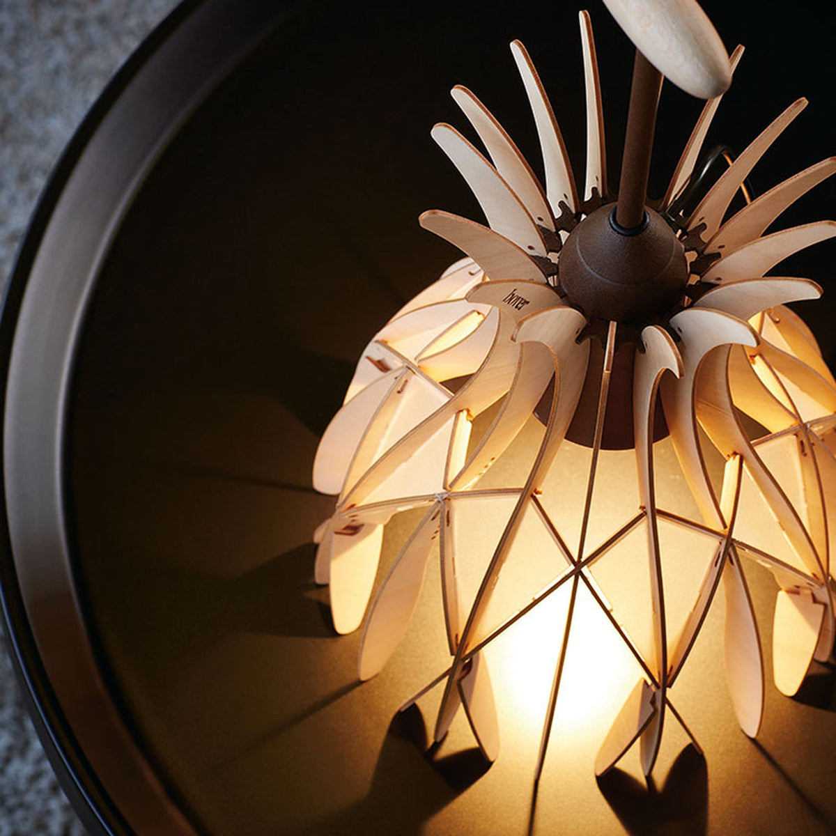 Domita M/36 wood bell table lamp with interlocking pale beech slats forming a bell-shaped shade, brown central stem and round flat knob, illuminated from within.